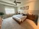 Main bedroom with plush carpet and wood furniture at 5652 Arborvista Dr, Saint Cloud, FL 34771