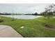 Peaceful lakefront view with grassy areas at 5652 Arborvista Dr, Saint Cloud, FL 34771