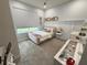 Charming bedroom with pink bed, vanity, and decorative wall at 5652 Arborvista Dr, Saint Cloud, FL 34771