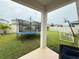 Large backyard with trampoline, soccer goal, and basketball hoop at 5652 Arborvista Dr, Saint Cloud, FL 34771