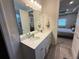 Double vanity bathroom with a large mirror and plenty of counter space at 5652 Arborvista Dr, Saint Cloud, FL 34771