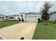 House exterior with well-manicured lawn at 5652 Arborvista Dr, Saint Cloud, FL 34771