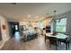 Modern kitchen with white cabinets, large island, and stainless steel appliances at 5652 Arborvista Dr, Saint Cloud, FL 34771