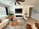 Living room with fireplace, comfortable seating, and stylish decor at 5652 Arborvista Dr, Saint Cloud, FL 34771