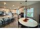 Modern kitchen with island, white cabinets, and stainless steel appliances at 5652 Arborvista Dr, Saint Cloud, FL 34771