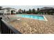 Community pool with lounge chairs and a patio area at 5652 Arborvista Dr, Saint Cloud, FL 34771
