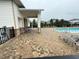 Community pool area with covered patio and seating at 5652 Arborvista Dr, Saint Cloud, FL 34771
