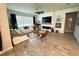 Spacious living area featuring hardwood floors and a modern fireplace at 5652 Arborvista Dr, Saint Cloud, FL 34771