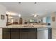 Kitchen island with granite countertops and a double sink at 226 Brunswick Dr, Davenport, FL 33837