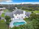 Two-story house with a kidney-shaped pool and a spacious backyard at 4155 Quail Wood Dr, St Cloud, FL 34772