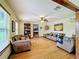 Spacious living room with hardwood floors and comfortable sofas at 4155 Quail Wood Dr, St Cloud, FL 34772