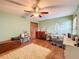 Bedroom with desk, ceiling fan, and rug at 4155 Quail Wood Dr, Saint Cloud, FL 34772