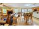 Eat-in kitchen with hardwood floors, wood cabinets, and a breakfast bar at 4155 Quail Wood Dr, St Cloud, FL 34772