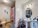 Bathroom featuring a shower, toilet and sink at 4155 Quail Wood Dr, St Cloud, FL 34772