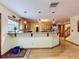 Kitchen with breakfast bar and hardwood floors at 4155 Quail Wood Dr, St Cloud, FL 34772