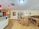 Bright dining area with wood floors and a table for six at 4155 Quail Wood Dr, Saint Cloud, FL 34772