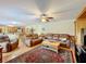 Open concept living room with hardwood floors and a view of the kitchen at 4155 Quail Wood Dr, St Cloud, FL 34772