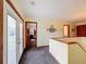 Upstairs hallway with doors to bedrooms and a view of a bedroom at 4155 Quail Wood Dr, St Cloud, FL 34772