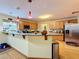 Kitchen features granite countertops and a breakfast bar at 4155 Quail Wood Dr, St Cloud, FL 34772