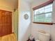 Bathroom with shower, toilet and window at 4155 Quail Wood Dr, St Cloud, FL 34772