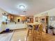 Well-equipped kitchen with wood cabinets, granite countertops, and stainless steel appliances at 4155 Quail Wood Dr, St Cloud, FL 34772