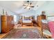 Well-lit bedroom with wood floors and a ceiling fan at 4155 Quail Wood Dr, St Cloud, FL 34772