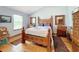 Cozy bedroom with wood floors and a comfortable bed at 4155 Quail Wood Dr, St Cloud, FL 34772