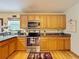 Spacious kitchen with stainless steel appliances and granite countertops at 4155 Quail Wood Dr, St Cloud, FL 34772