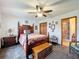 Spacious bedroom with a wooden bed frame and ceiling fan at 4155 Quail Wood Dr, St Cloud, FL 34772