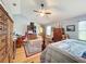 Bright bedroom with wood floors and a comfortable bed at 4155 Quail Wood Dr, St Cloud, FL 34772