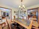 Dining room features a slate-top table and chandelier at 4155 Quail Wood Dr, Saint Cloud, FL 34772