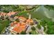 Community aerial view; buildings, lake, and landscaping at 196 Ventana Dr, Poinciana, FL 34759