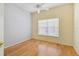 Bright bedroom with light wood floors, ceiling fan, and window blinds at 196 Ventana Dr, Poinciana, FL 34759