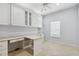 Bright office with built-in white cabinets and a large desk at 196 Ventana Dr, Poinciana, FL 34759