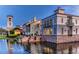 Stunning waterfront views of community buildings at dusk at 196 Ventana Dr, Poinciana, FL 34759