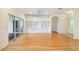 Spacious living room with hardwood floors and built-in shelving at 196 Ventana Dr, Poinciana, FL 34759