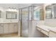 Bathroom boasts a large shower, vanity with drawers, and updated fixtures at 196 Ventana Dr, Poinciana, FL 34759