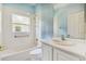 Clean bathroom with a tub, shower, and white vanity at 196 Ventana Dr, Poinciana, FL 34759