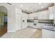 Kitchen with white cabinets and tile floor at 196 Ventana Dr, Poinciana, FL 34759