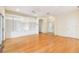 Hardwood floor living room with built-in shelving and access to the backyard at 196 Ventana Dr, Poinciana, FL 34759