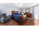 Bright bedroom with wood flooring and en-suite bathroom access at 2090 Big Buck Dr, St Cloud, FL 34772