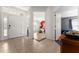 Bright and spacious entryway with tile flooring, leading to living room and bedroom at 2090 Big Buck Dr, St Cloud, FL 34772