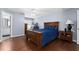 Comfortable bedroom with wood flooring and en-suite bathroom access at 2090 Big Buck Dr, St Cloud, FL 34772
