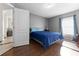 Bedroom featuring a comfortable bed and dark wood floors at 2090 Big Buck Dr, St Cloud, FL 34772