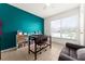 Bright home office features built-in shelving and large window at 2090 Big Buck Dr, St Cloud, FL 34772