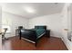 Bedroom with a queen-size bed and wood floors at 2090 Big Buck Dr, St Cloud, FL 34772