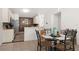 Bright dining area with glass-top table and four chairs at 2090 Big Buck Dr, St Cloud, FL 34772