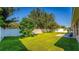 Large backyard with grassy area and white fence at 2090 Big Buck Dr, St Cloud, FL 34772