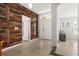 Entryway showcasing a wood-like accent wall and tile flooring at 2090 Big Buck Dr, St Cloud, FL 34772