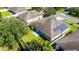 Aerial view showcasing home, yard, and solar panels at 2090 Big Buck Dr, St Cloud, FL 34772